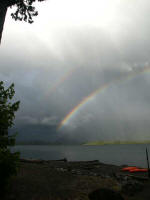 Double rainbow: a second rainbow on the outside of the first, brighter rainbow, from raindrops higher than those causing the "primary rainbow", and special�they internally reflect the incoming sunlight twice rather than just once.
